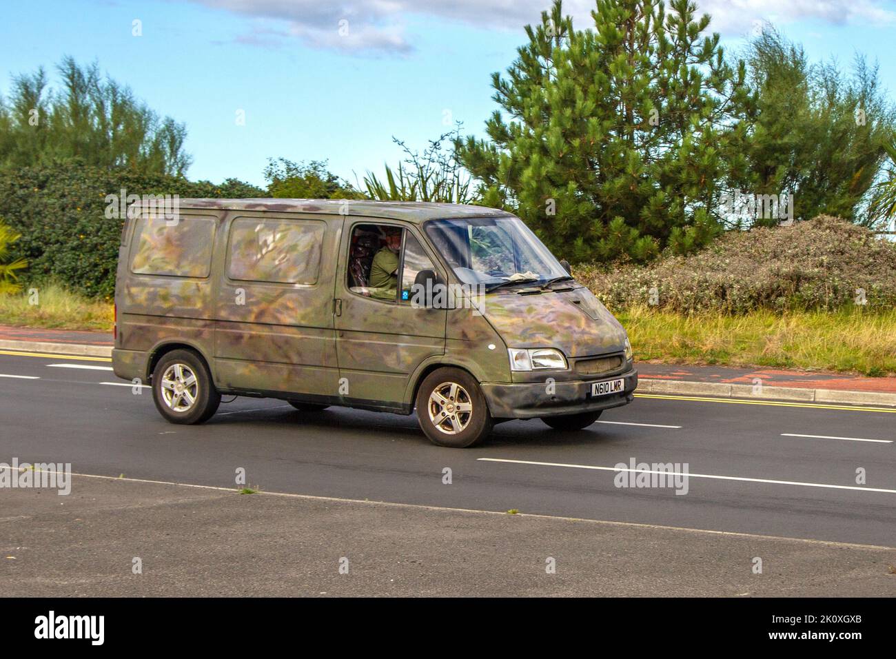 1996 9-s nineties Custom hand-painted multi-coloured FORD TRANSIT 80 70PS 2496cc DIESEL P/V panel van, airsoft military spray blotches, irregular smudges and blots Stock Photo