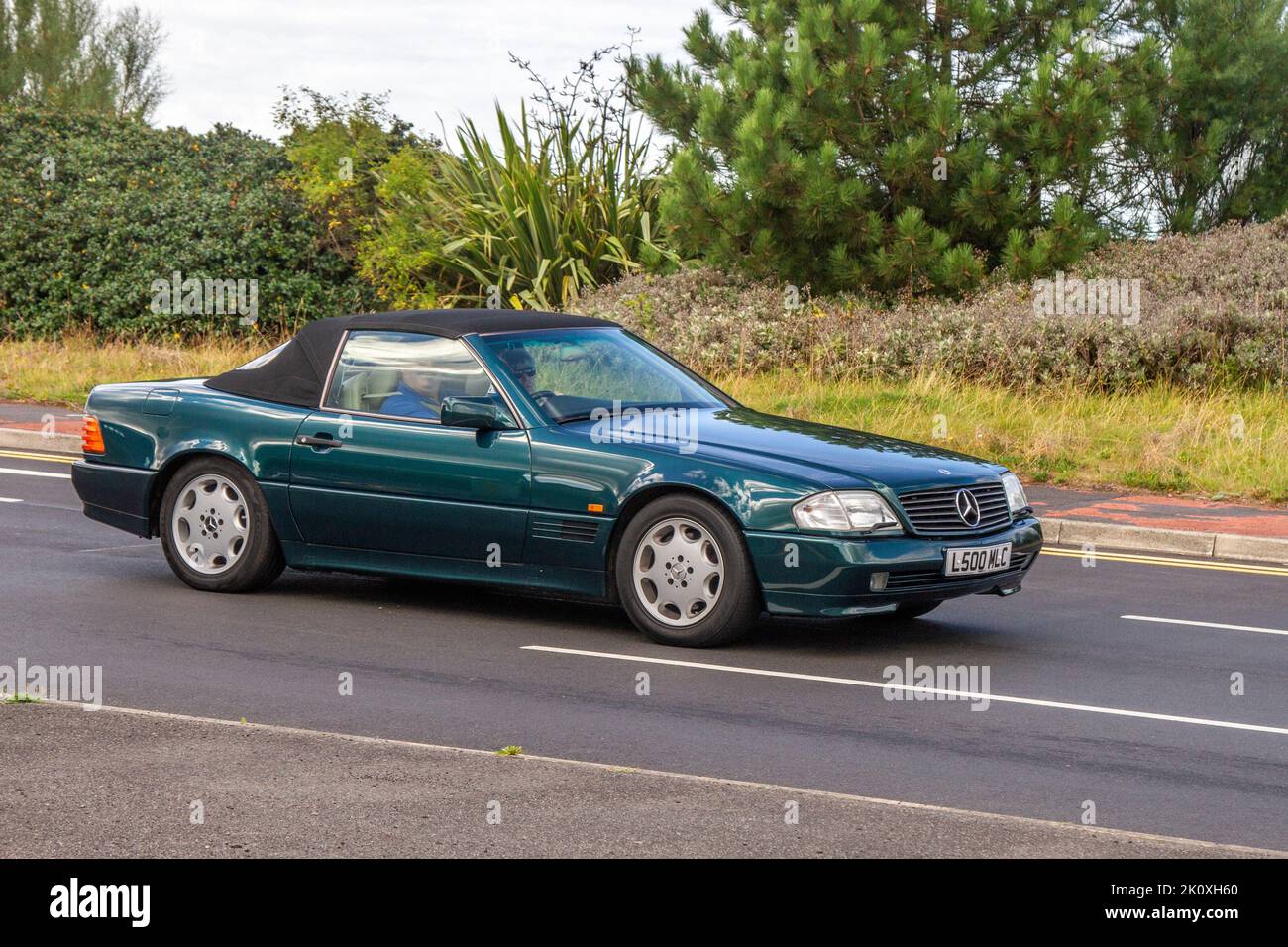 1994 90s nineties Green MERCEDES BENZ 4973 cc 4-speed automatic; at the Southport Classic car and Speed event on the seafront promenade. UK Stock Photo