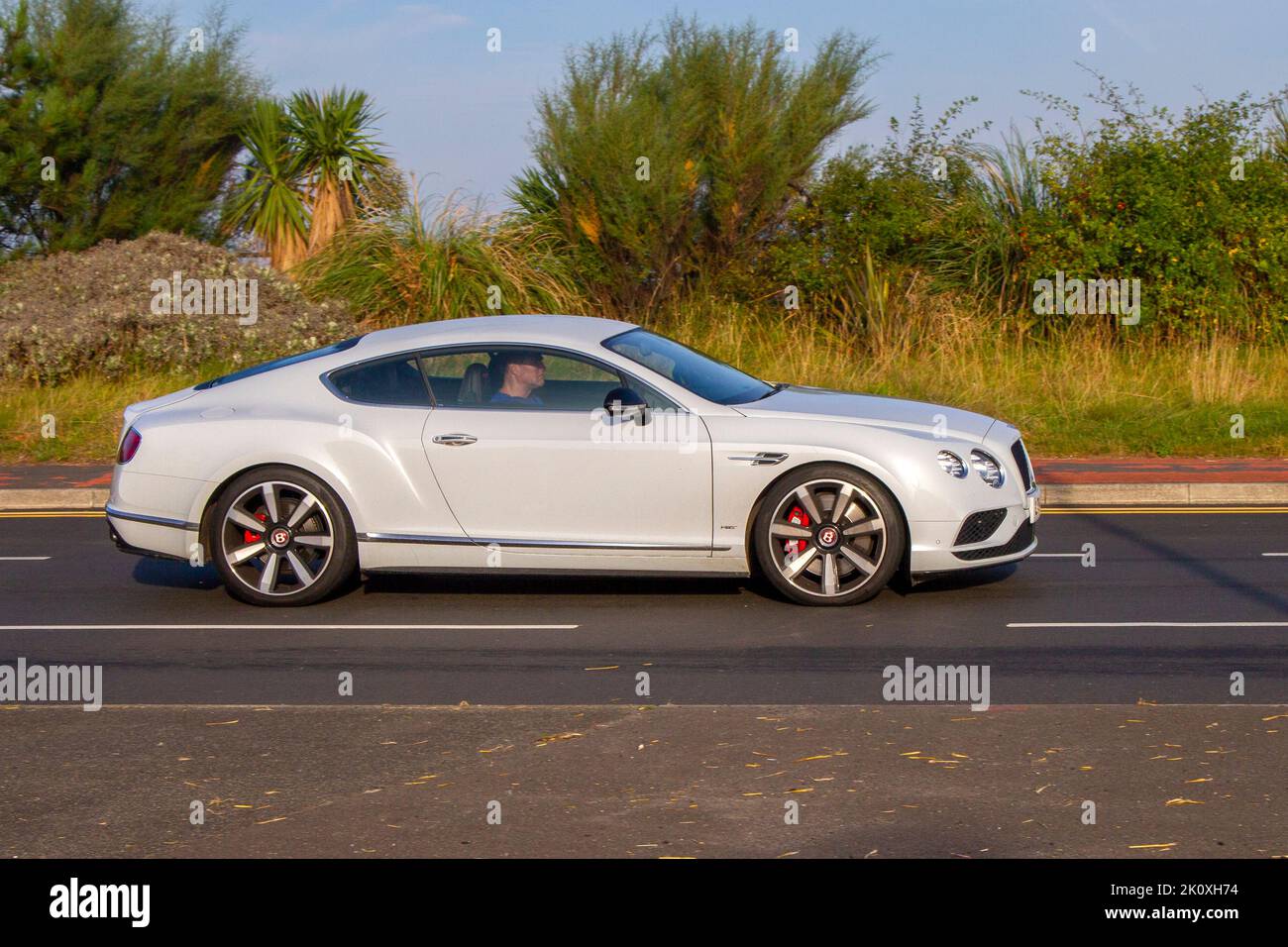 2017 Grey White BENTLEY CONTINENTAL 3993cc 8 speed automatic travelling on the seafront promenade in Southport, UK Stock Photo