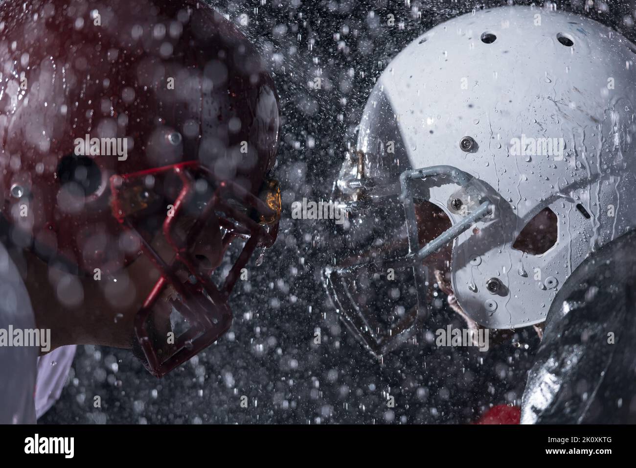 two american football players face to face in silhouette shadow on