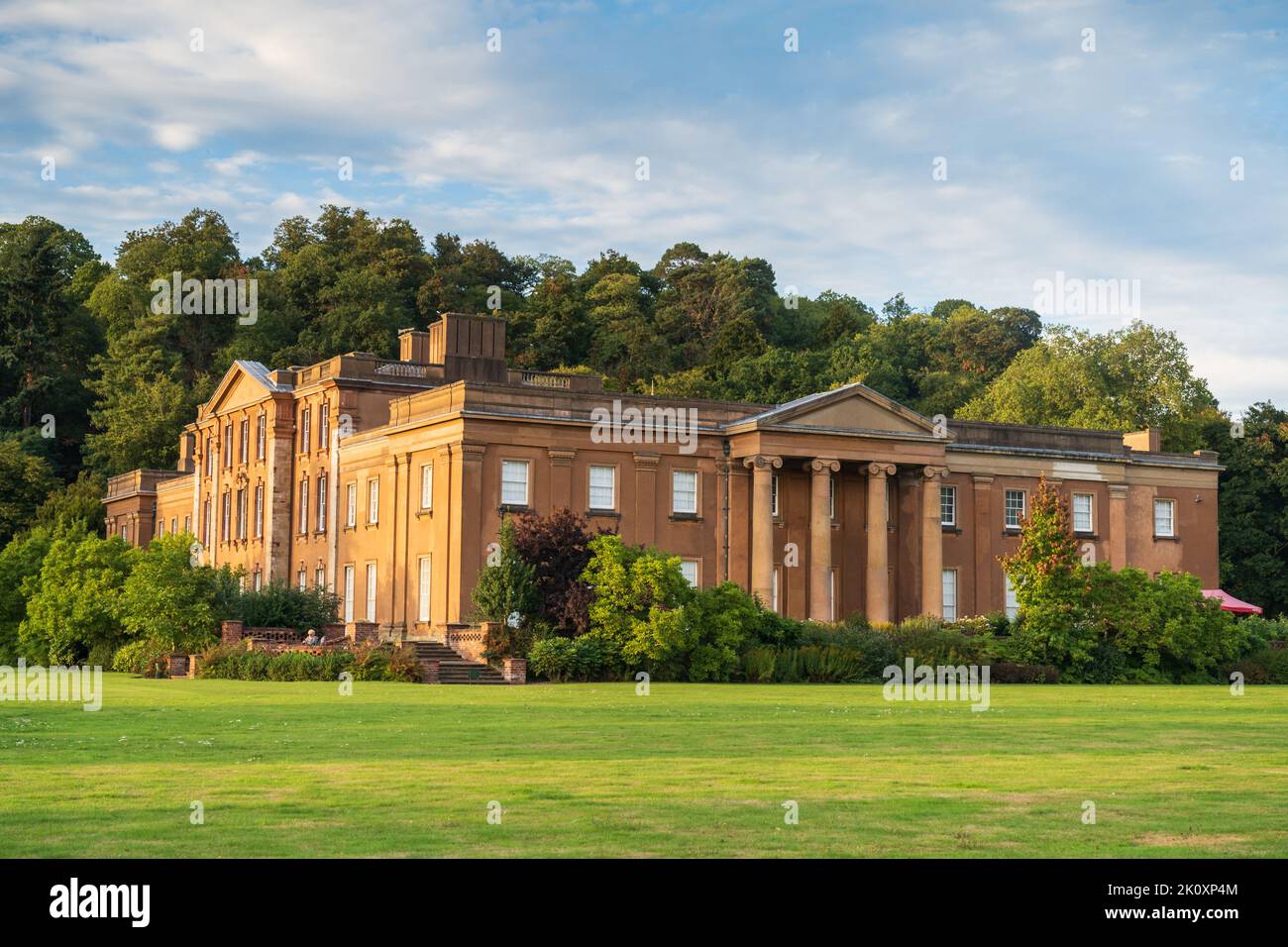 Himley Hall and Park in Staffordshire UK refllecting the last light of the day shining on the building. Stock Photo