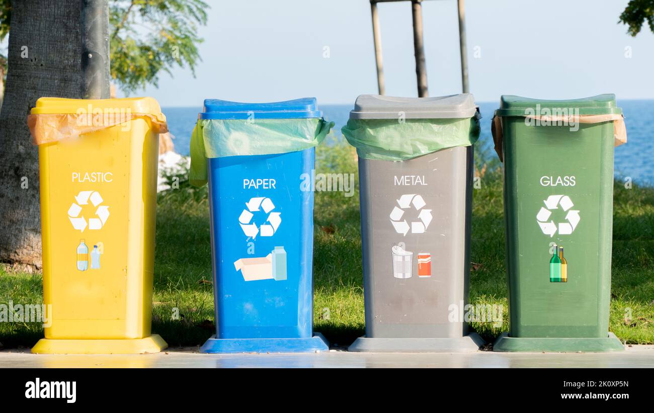 Separate waste collection - waste bins for plastic, glass, paper and metal Stock Photo