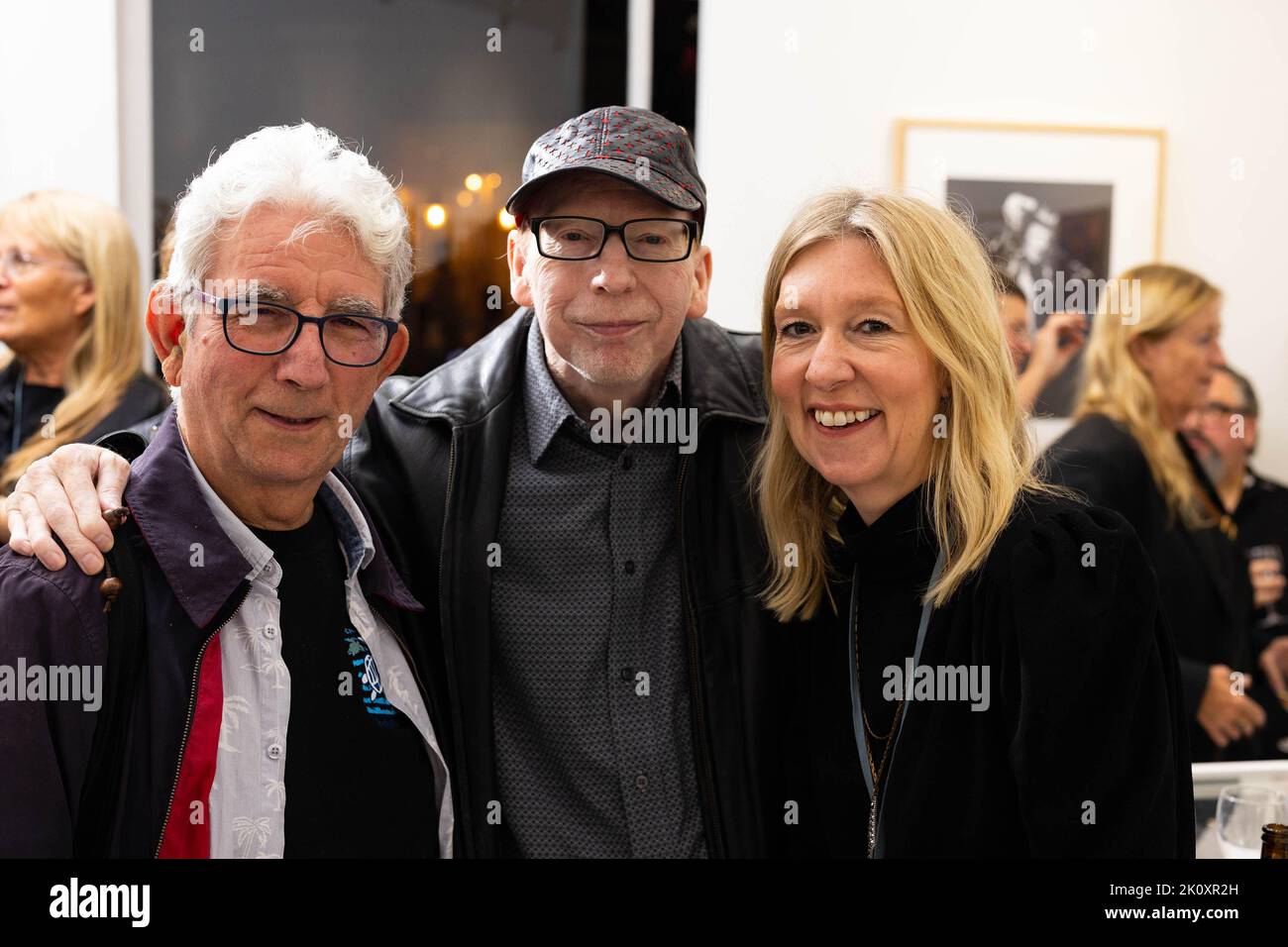 EDITORIAL USE ONLY (Left to right) Phil Lancaster, drummer with Bowie's band - The Lower Third, Kevin Cann, consultant editor on the original Moonage Daydream publication and Catherine Roylance, of Genesis Publications attend an exhibition of photographs by Mick Rock from Moonage Daydream - The Life and Times of Ziggy Stardust, as Genesis Publications release a special anniversary edition of the book to mark 50 years since Bowie released The Rise and Fall of Ziggy Stardust and the Spiders from Mars, at Atlas Gallery in London. Issue date: Wednesday September 14, 2022. Stock Photo