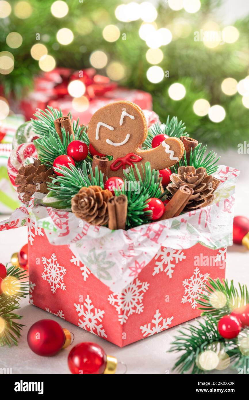 Christmas Decorations with Gingerbread man cookie and Gift Box. Stock Photo
