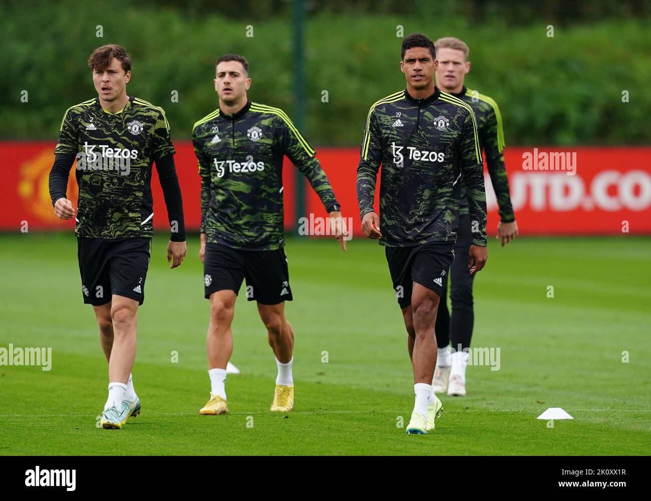 Manchester United's Victor Lindelof, Diogo Dalot and Raphael Varane during a training session at the Aon Training Complex, Greater Manchester. Picture date: Wednesday September 14, 2022. Stock Photo