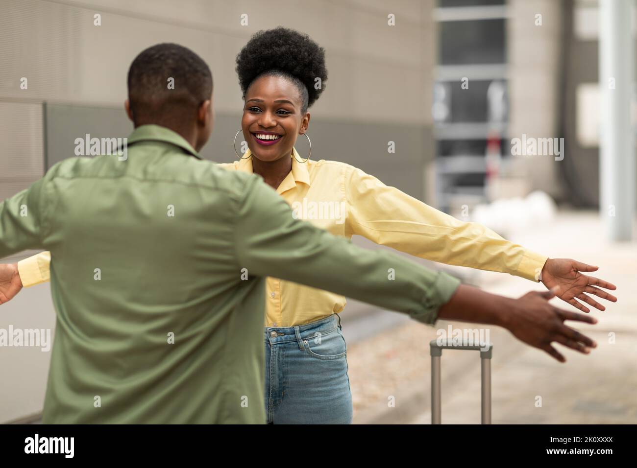 Happy business travelers meeting airport hi-res stock photography and  images - Alamy