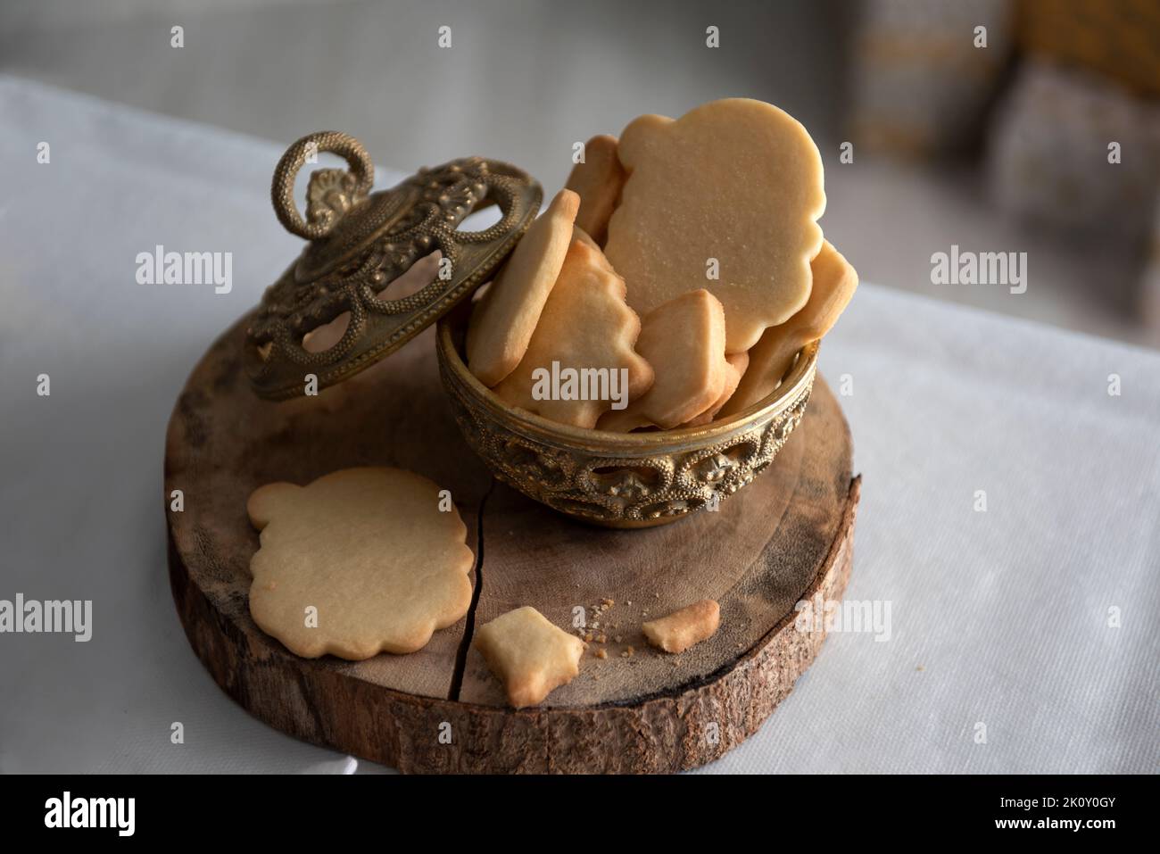 Homemade Christmas cookies in ceramic basket with festive decoration. Stock Photo
