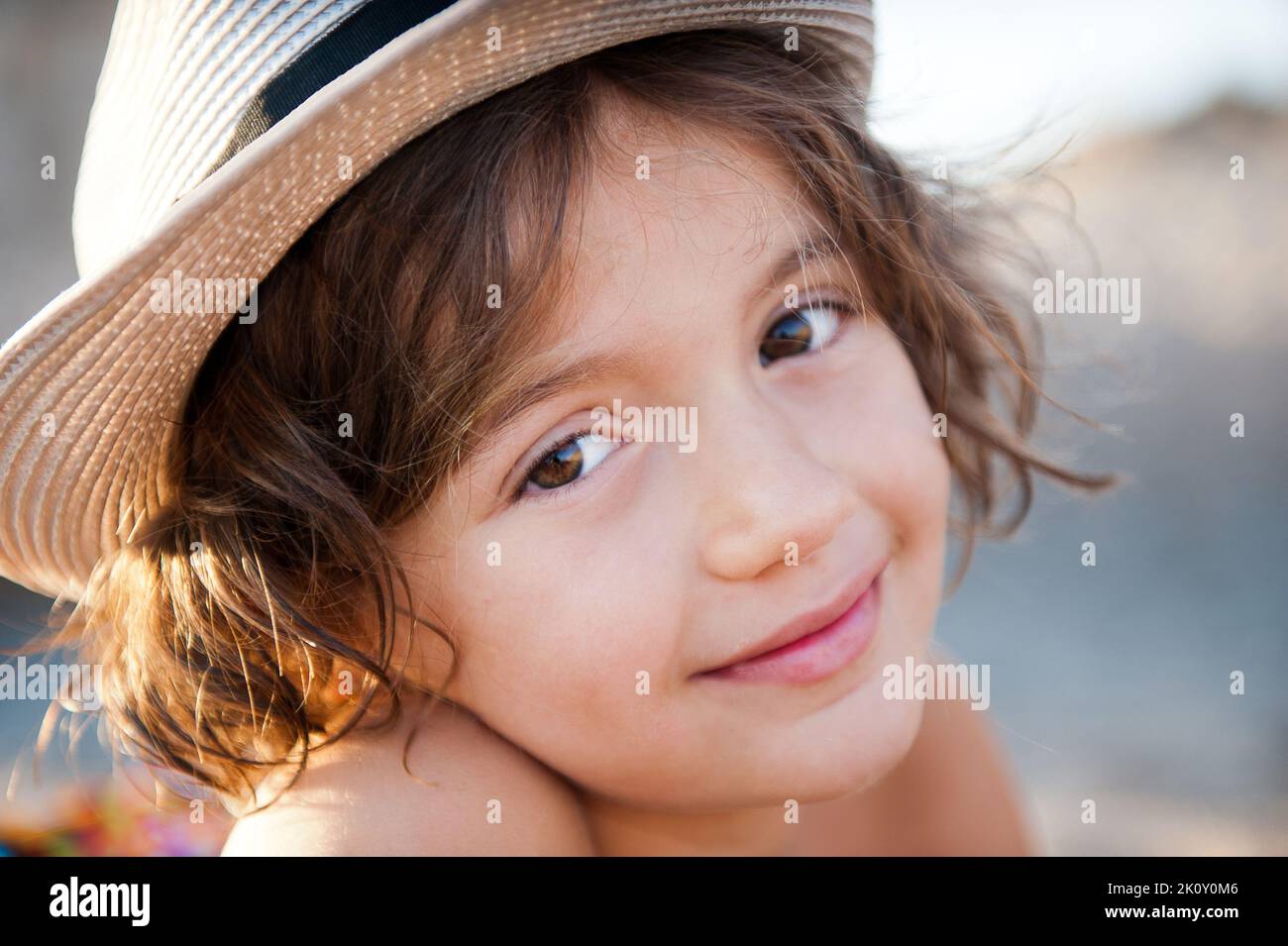 Sweet girl in a hat against nature Stock Photo