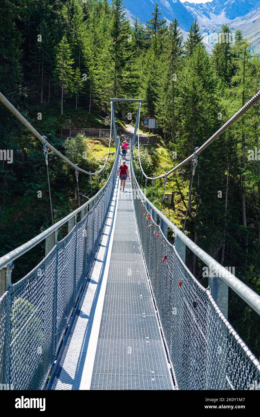 Metal suspension bridge above Langenfeld, in the Otztal Valley, the Tirol, Austria, EU, the European Alps Stock Photo
