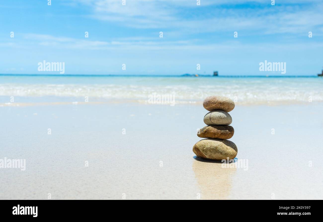 Stones balanced on beach. Zen stones meditation and relaxation. Japanese zen garden Stock Photo