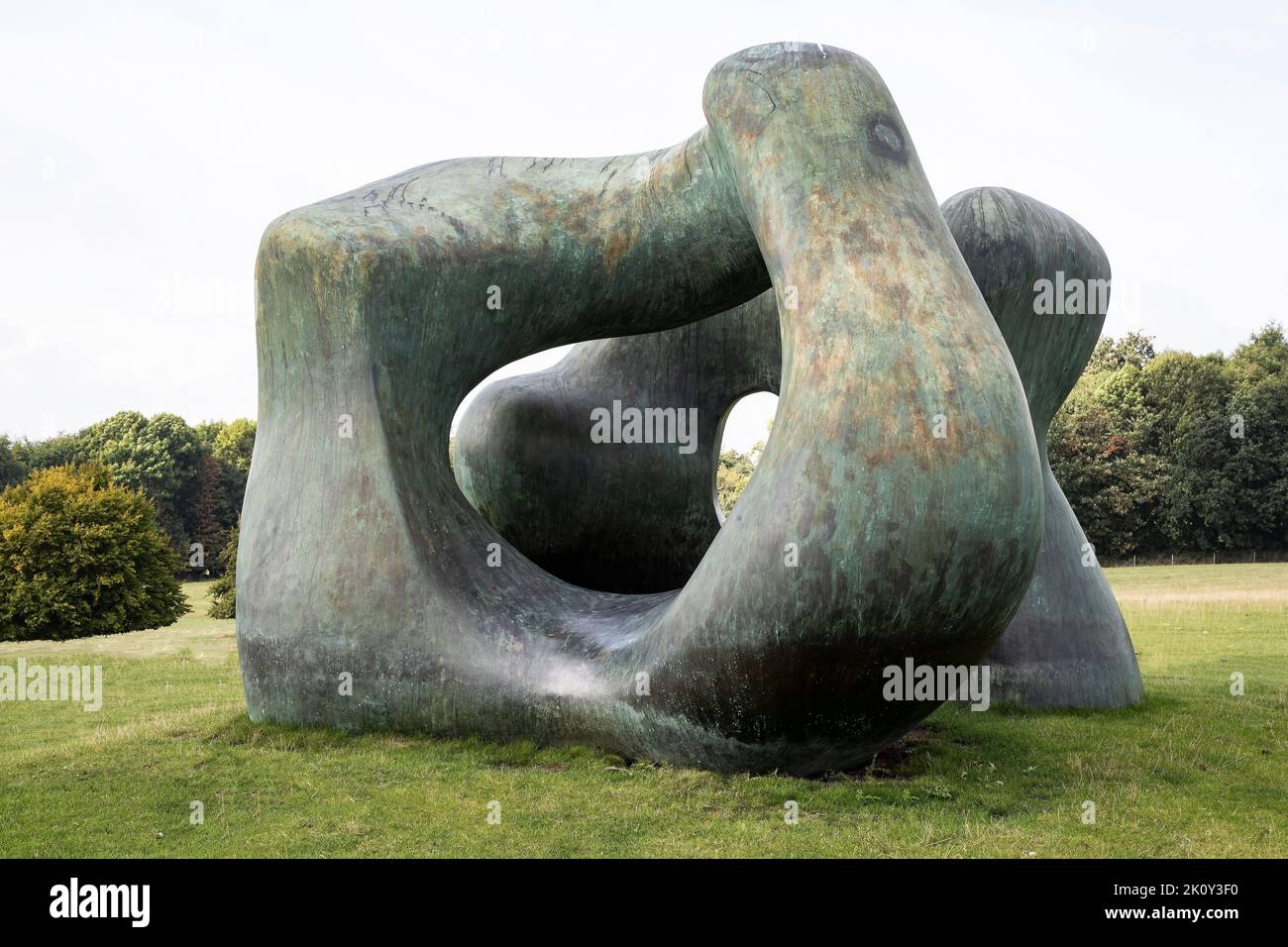 Henry Moore's Large Two Forms is a colossal bronze sculpture changes when viewed from different angles in the Yorkshire Sculpture Park, Wakefield. Stock Photo