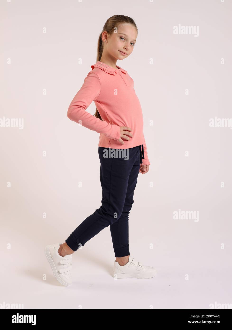 A little Caucasian girl posing on isolated white background Stock Photo ...