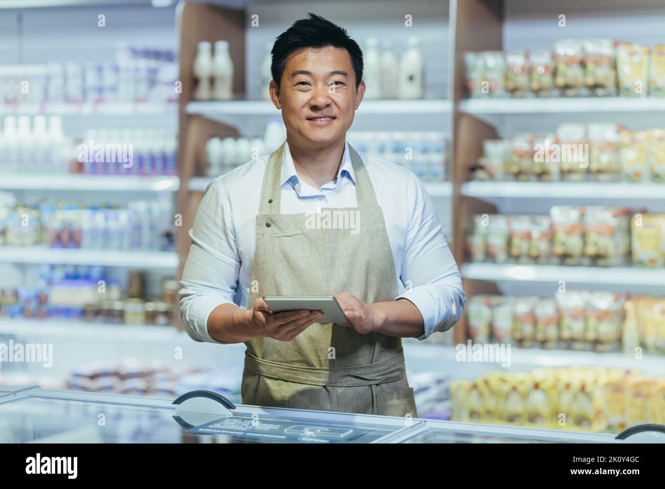 Grocery shop owner hires stock photography and images Alamy
