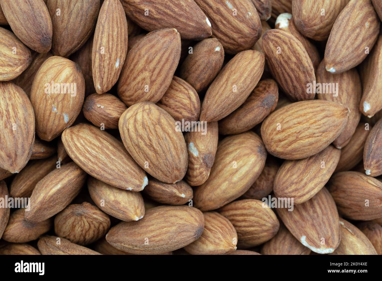 Close top view of a group of almond nuts. Stock Photo