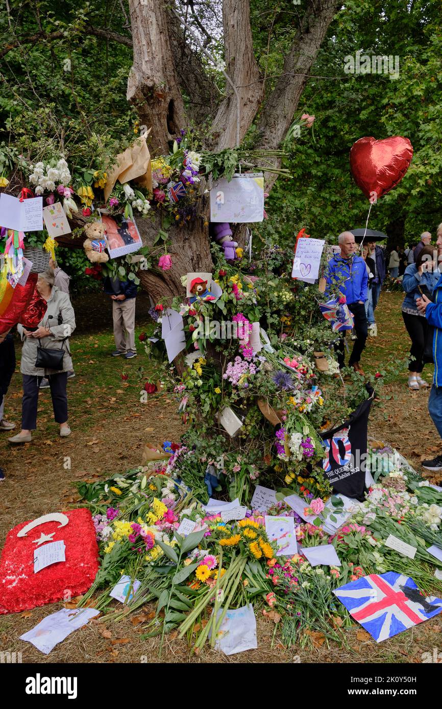 floral tributes to the late Queen festoon the grounds of Green park in London Stock Photo