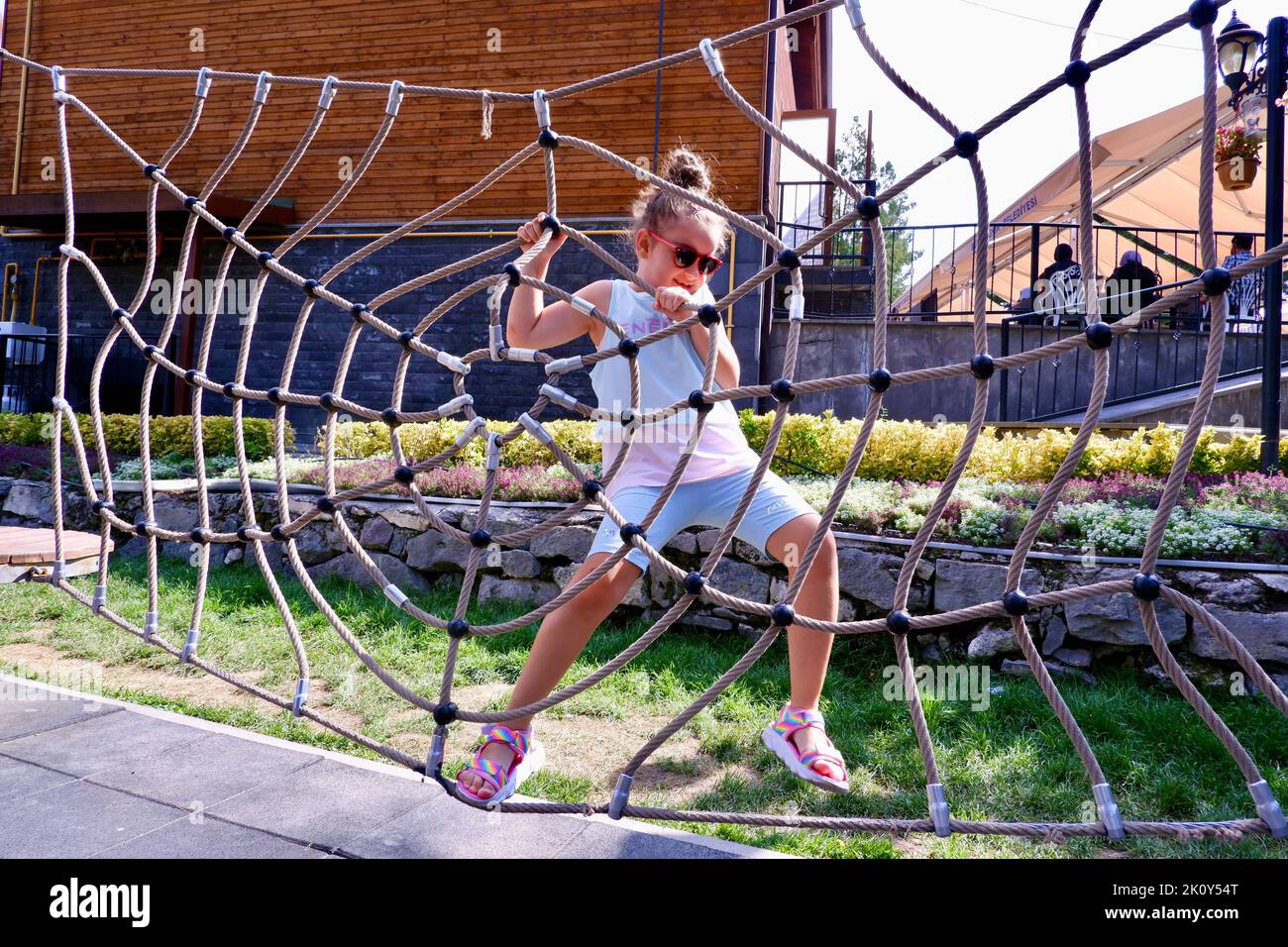 Child on ropes playground hi-res stock photography and images - Alamy