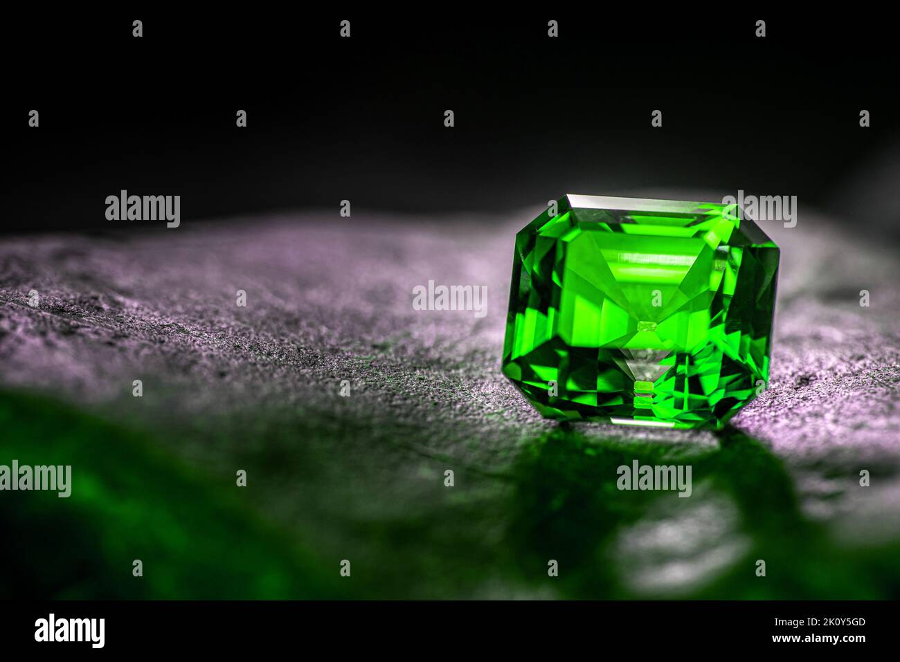 Luxury Green Loose Stone on Dark Background Stock Photo