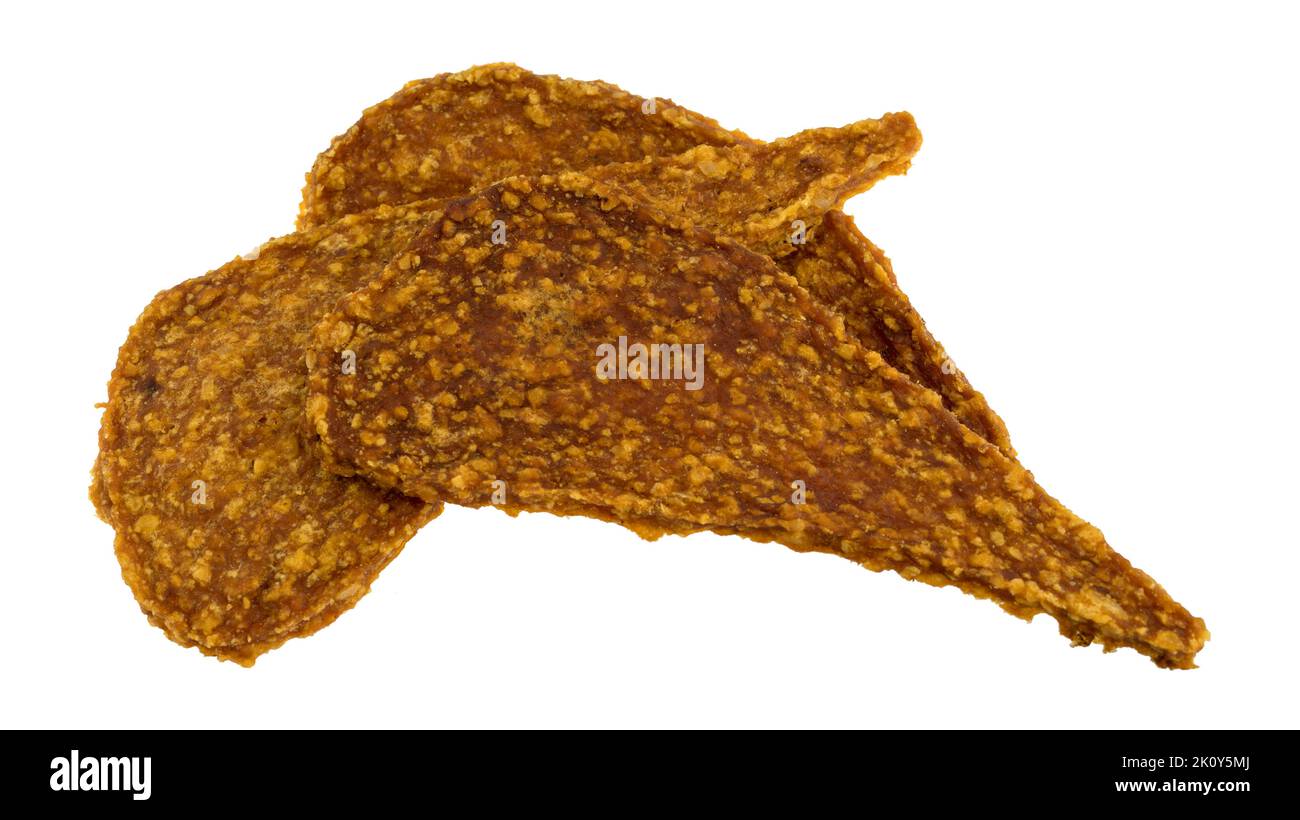 Side view of three pieces of duck jerky isolated on a white background. Stock Photo