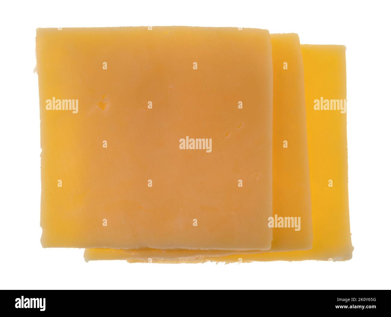 Overhead view of three slices of gouda cheese isolated on a white