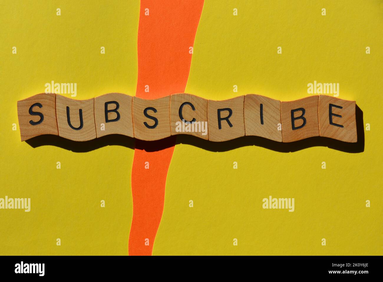 Subscribe, word in wooden alphabet letters isolated on background Stock Photo