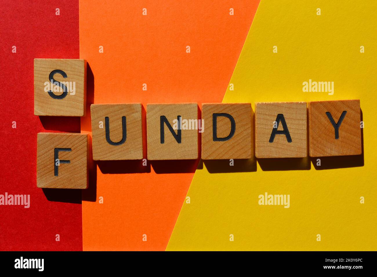 Sunday, Funday, words in wooden alphabet letters isolated on bright and colourful background Stock Photo
