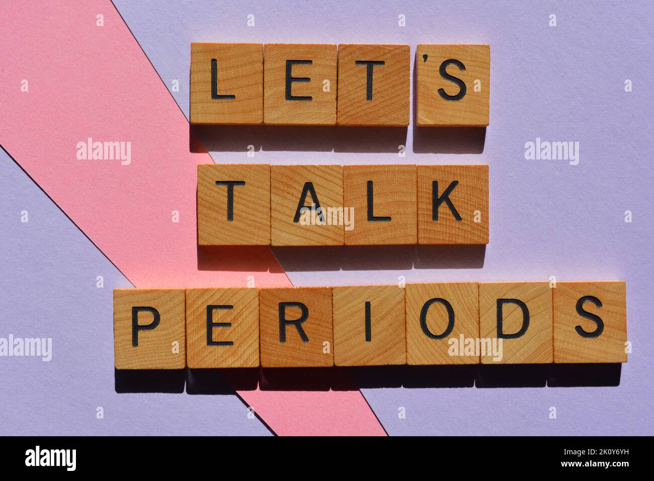 Let's Talk Periods, words in wooden alphabet letters isolated on background Stock Photo