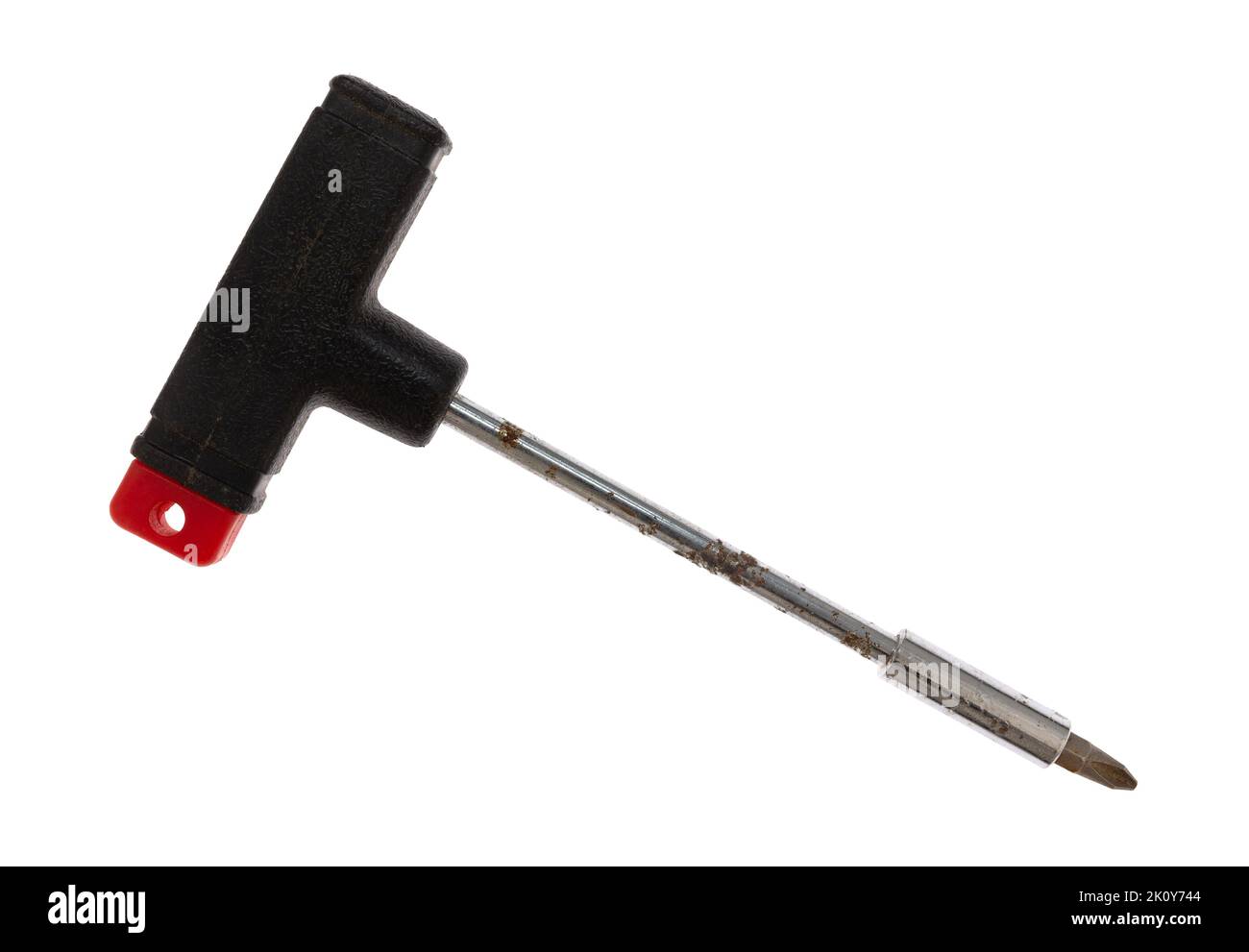 Old t handle screwdriver with Phillips bit isolated on a white background. Stock Photo