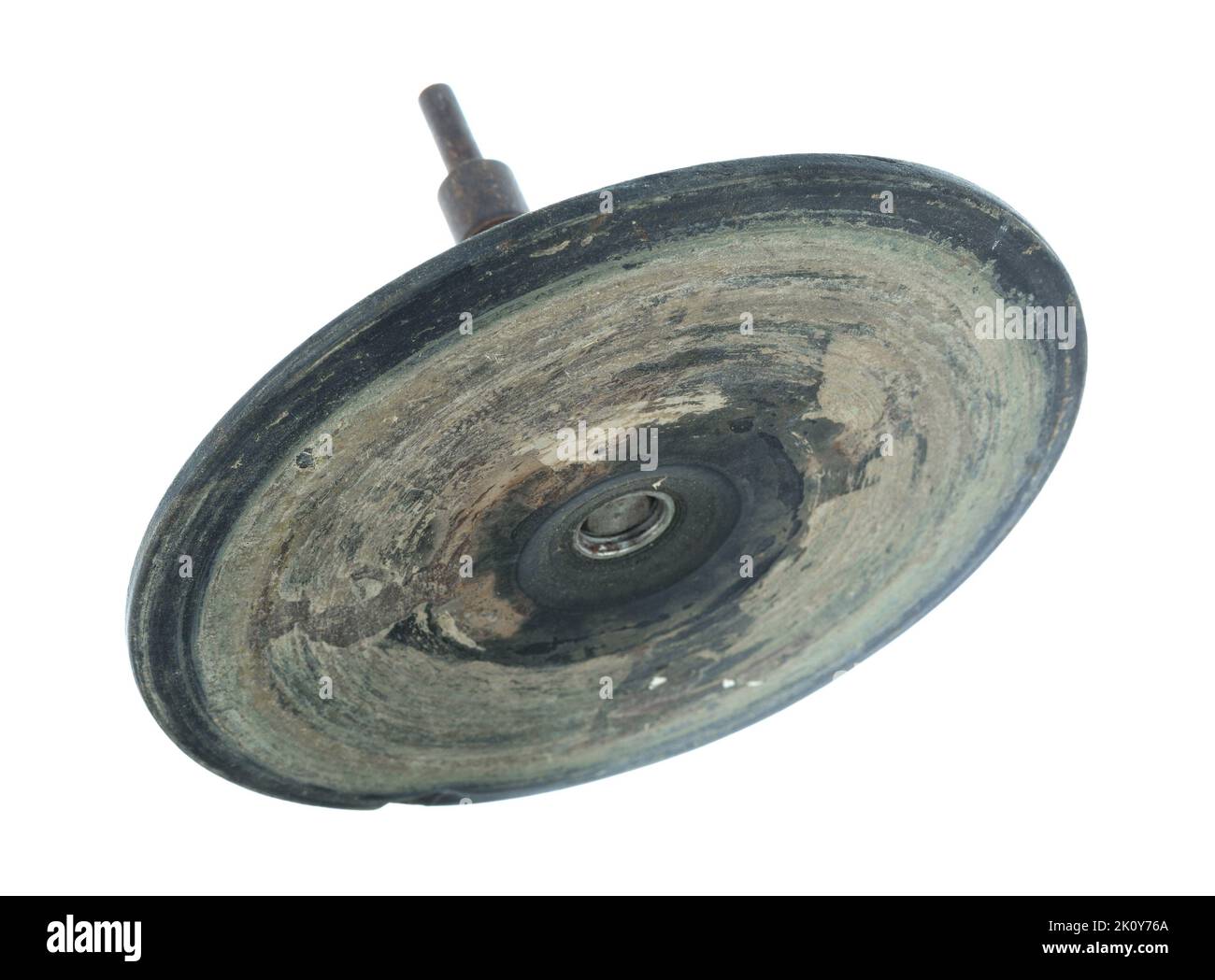 Side view of an old disc sander with adhesive residue isolated on a