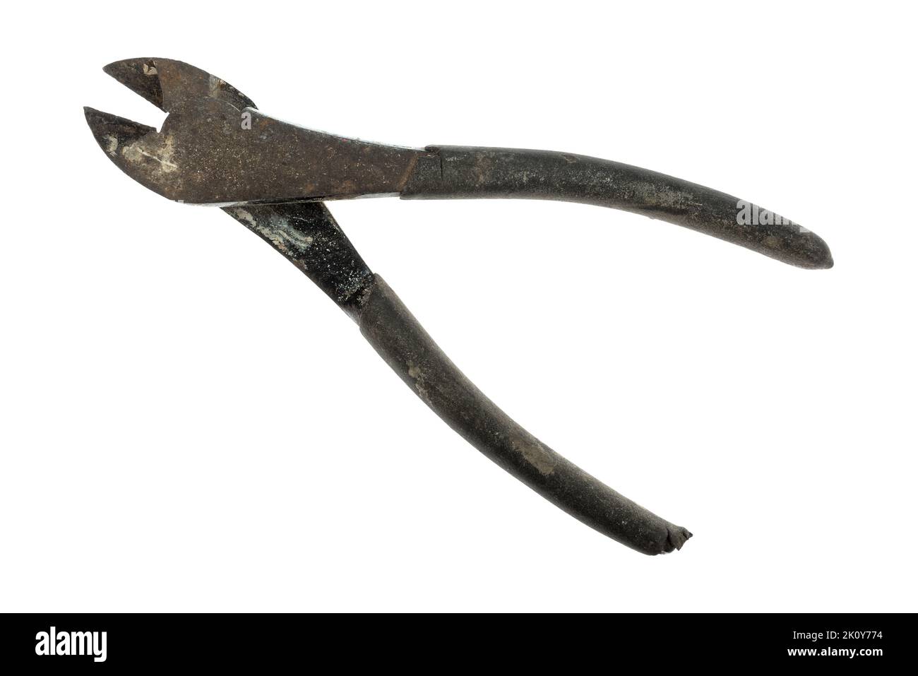 Top view of old wire cutters with rust and dirt from age with plastic on the handles isolated on a white background. Stock Photo