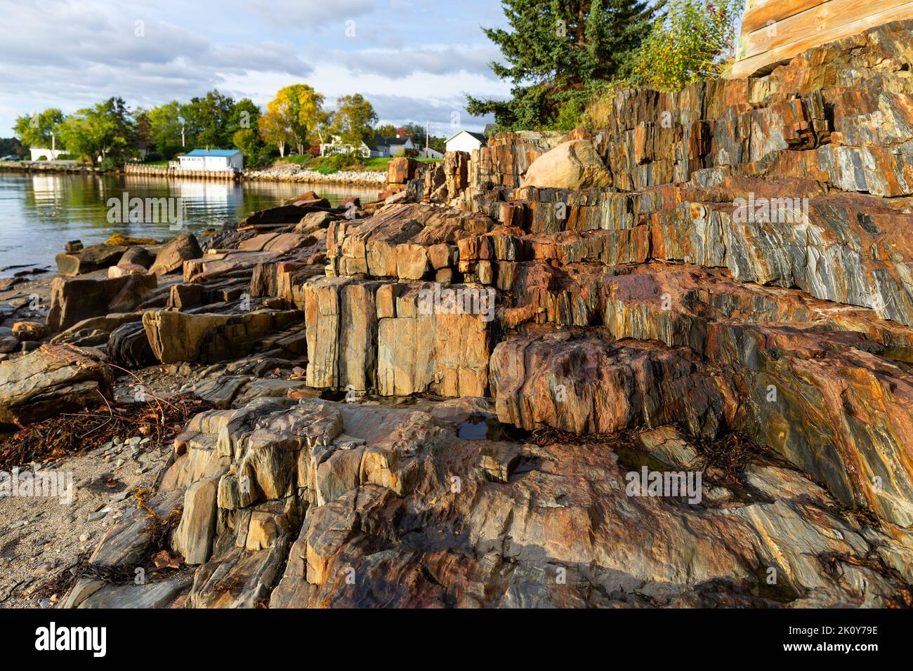 Low tide showing rugged rocks and ledges along the coast of Maine in the early morning light. Stock Photo