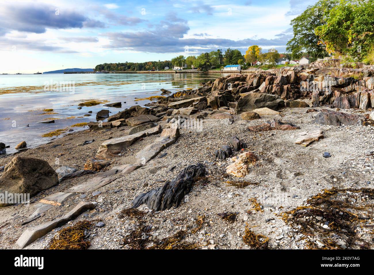 Wide view of the rocky coastline of Penobscot Bay in Maine in the early morning light. Stock Photo