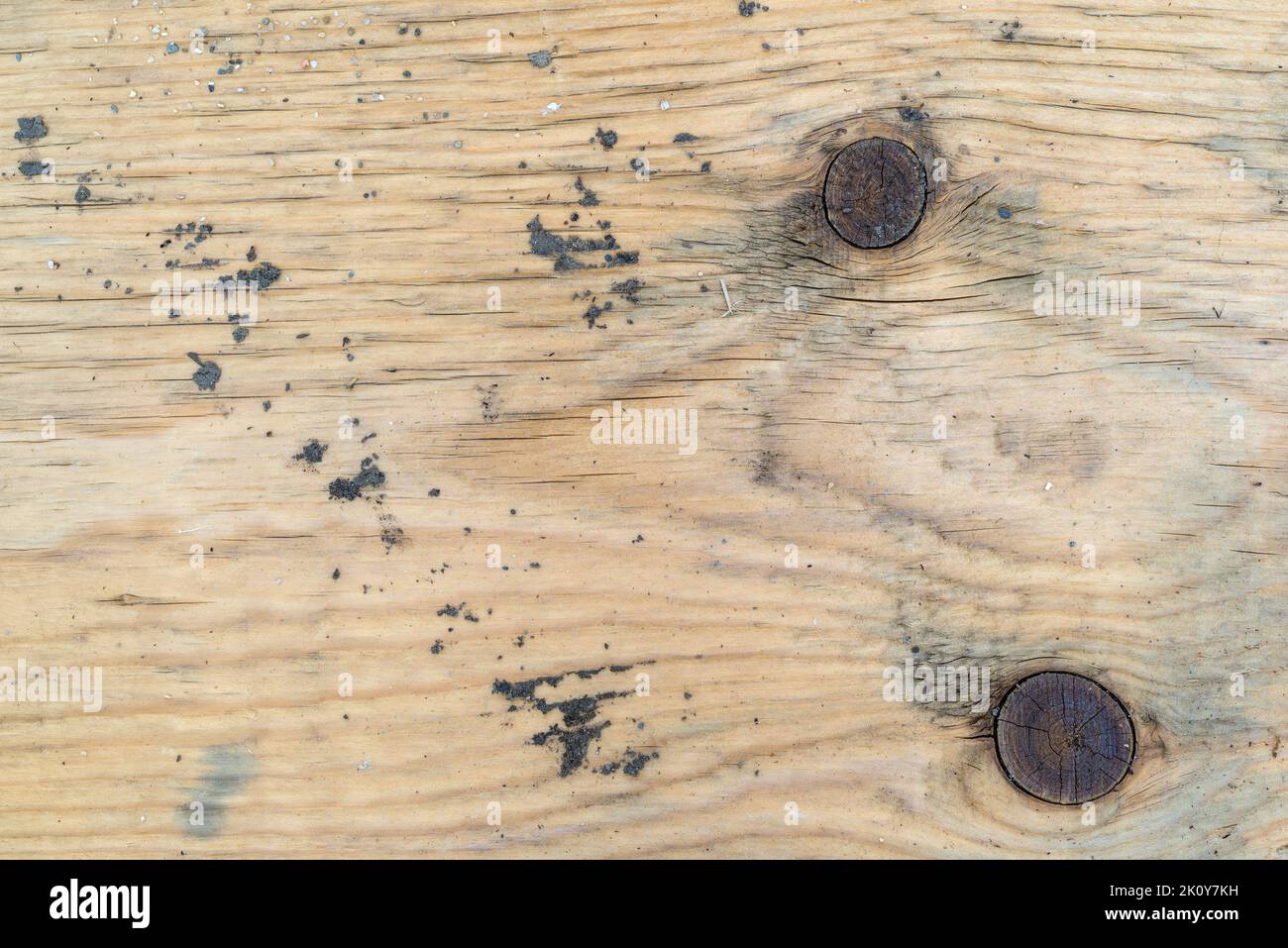 Top close view of a grungy old board that has been bleached with sunlight. Stock Photo