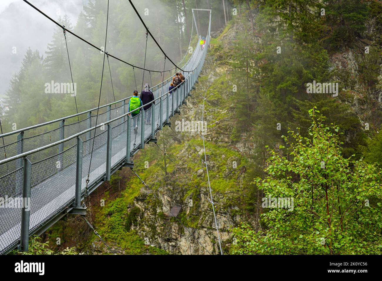 Metal suspension bridge above Langenfeld, in the Otztal Valley, the Tirol, Austria, EU, the European Alps Stock Photo