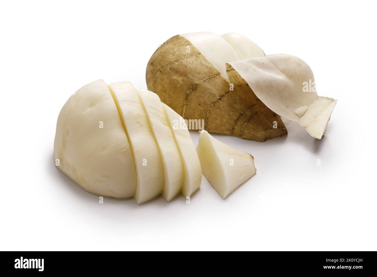 Peeled jicama skin and cut jicama. Jicama is a crispy, slightly sweet, Mexican edible tuber root. Stock Photo