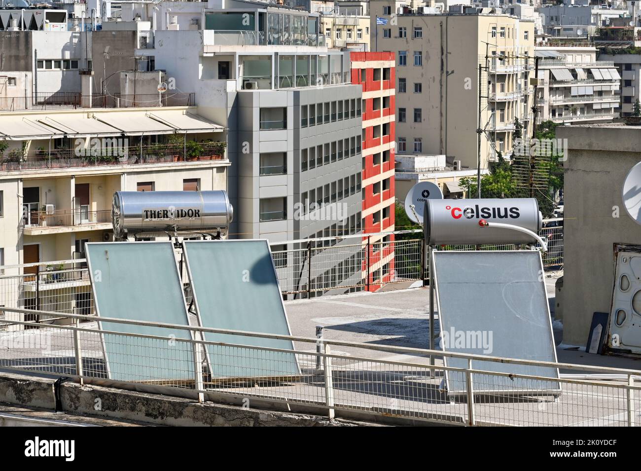 Athens, Greece - May 2022: Hot water heating system on the roof of a building in the city centre Stock Photo