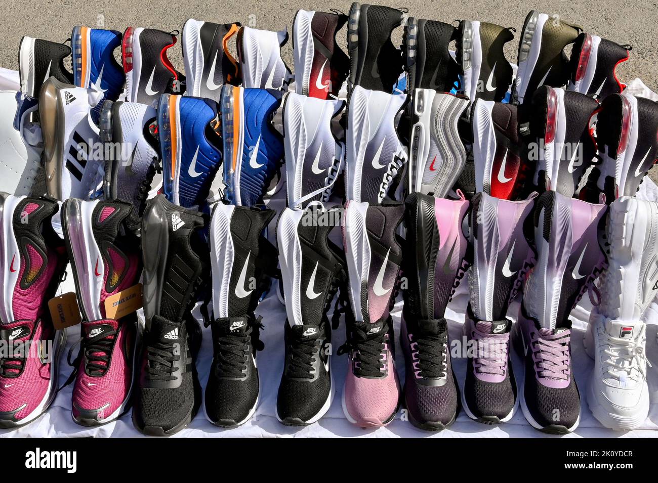 Athens, Greece - May 2022: Display of pairs of running shows with a Nike logo being sold by a street trader Stock Photo
