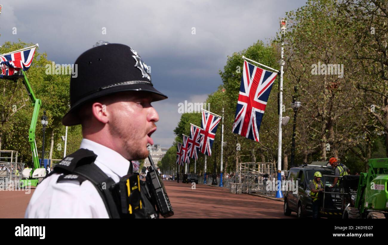 11 September 2022 - London UK: Policeman in The Mall while flags being hung Stock Photo