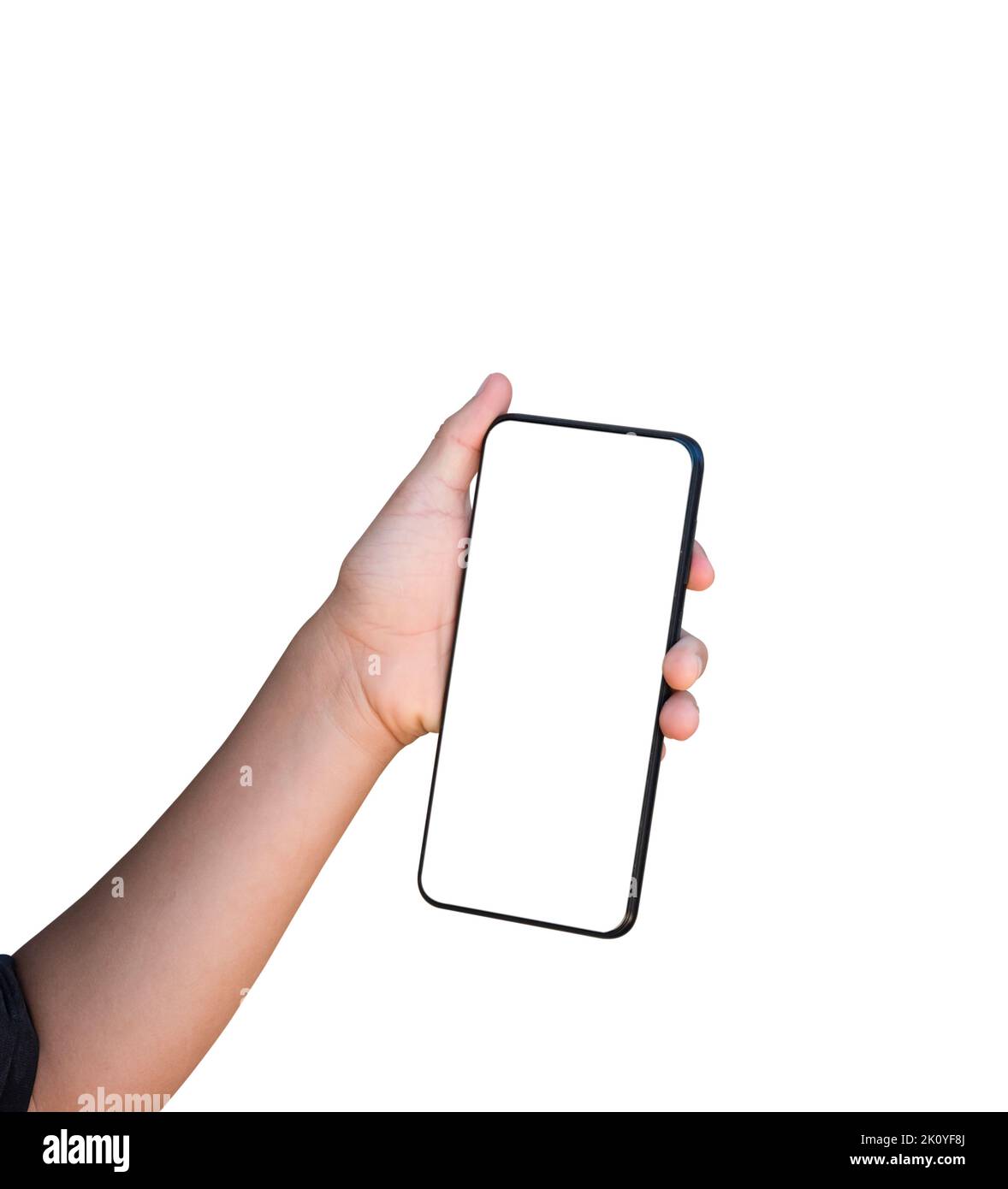 Child hand holding mobile phone isolated on white background. mock-up smartphone blank screen with clipping path Stock Photo