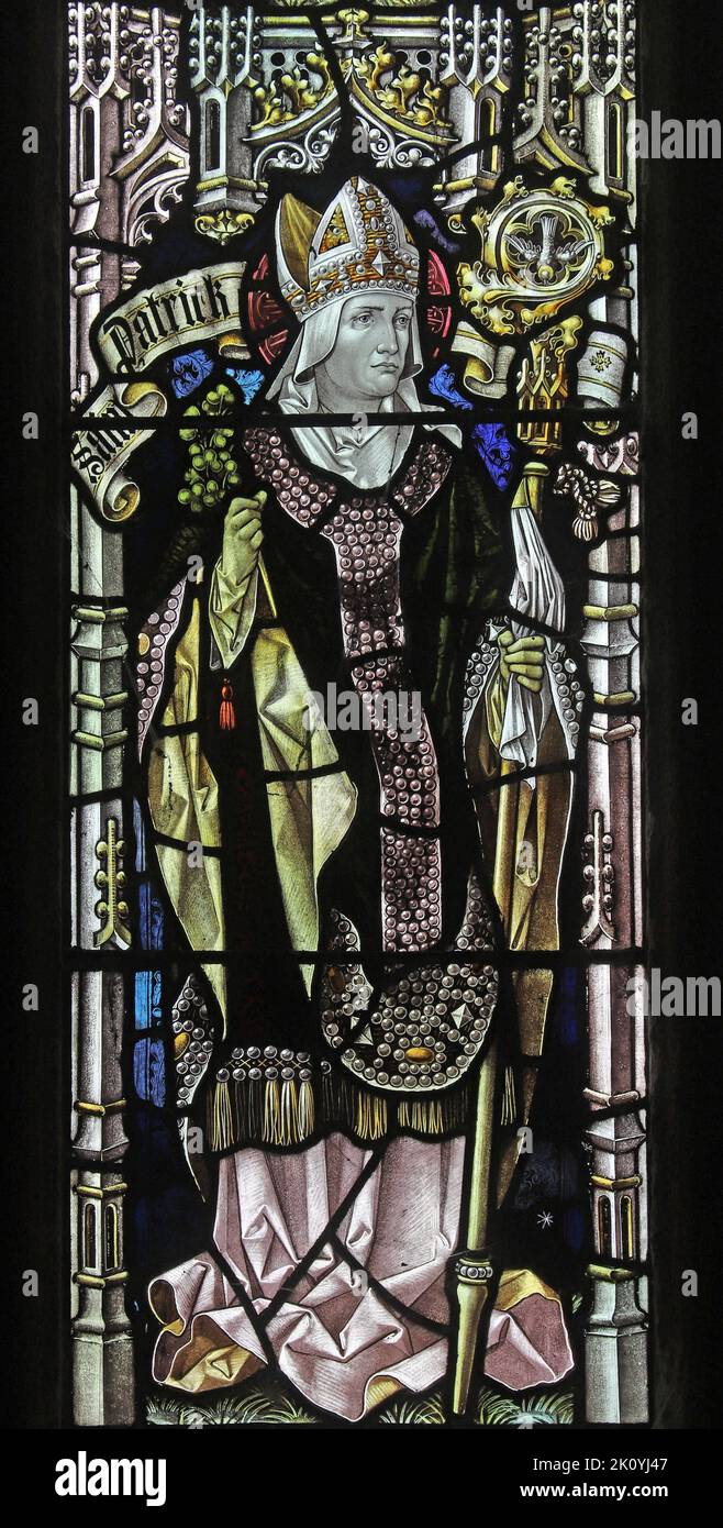 Stained glass window by Percy Bacon & Brothers depicting Saint Patrick, Mawgan-in-Pyder, Cornwall Stock Photo