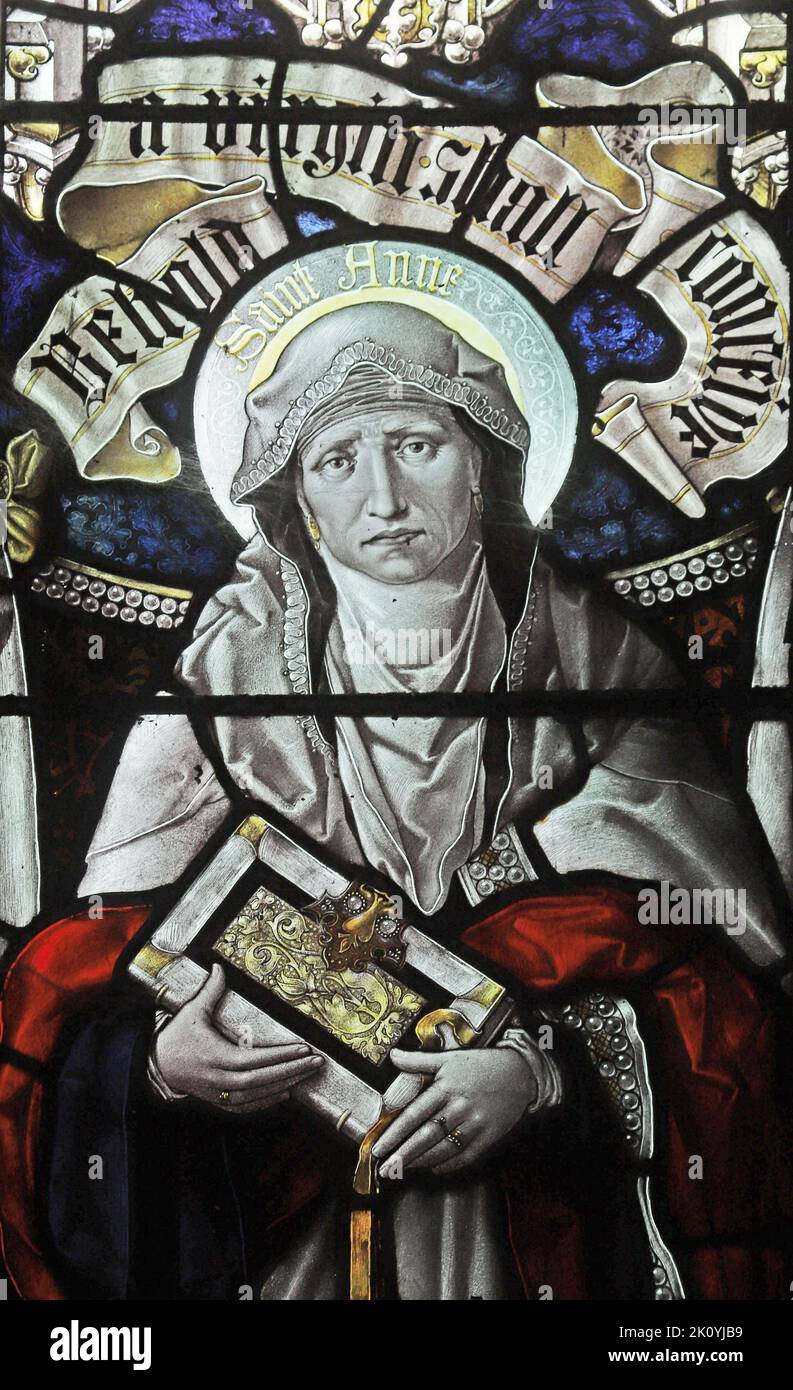 Stained glass window by Percy Bacon & Brothers depicting St Anne, mother of the Blessed Virgin Mary, Mawgan-in-Pyder, Cornwall Stock Photo