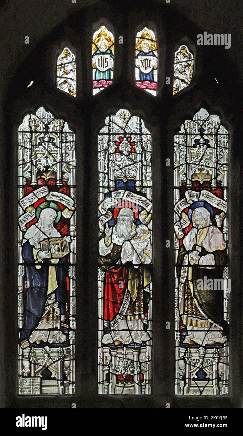 Stained glass window by Percy Bacon & Brothers depicting Presentation to Simeon in the Temple, Church of St Ladoca, Ladock, Cornwall Stock Photo