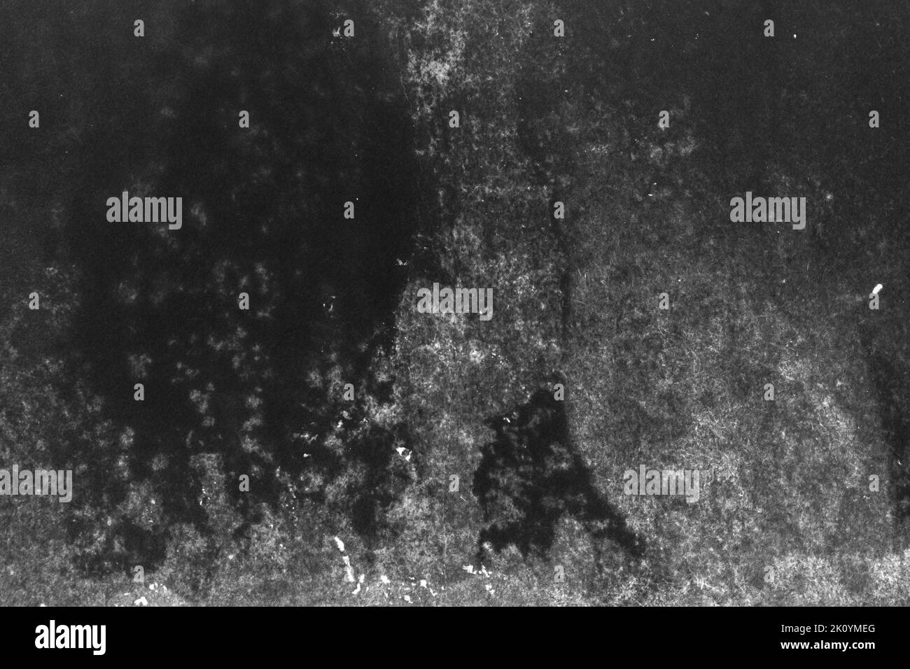 black and white texture of old paper with water stains as a background ...