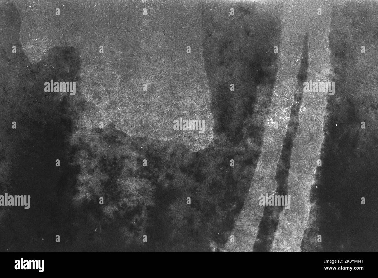 black and white texture of old paper with water stains as a background ...