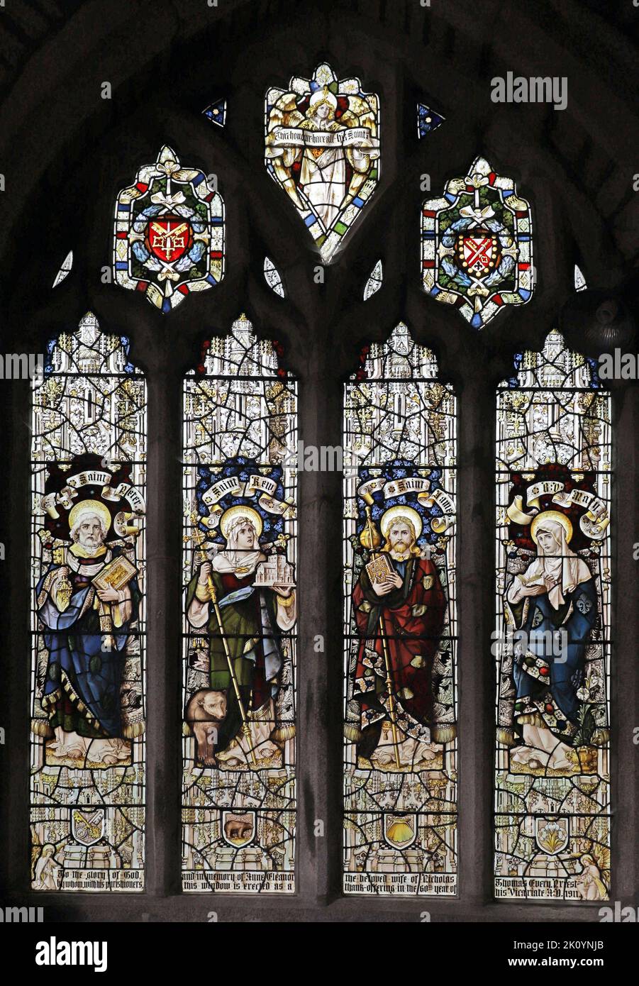 Stained glass window by Percy Bacon & Brothers depicting Saints Peter, Kew, James & the Blessed Virgin Mary, St James Church St Kew, Cornwall Stock Photo