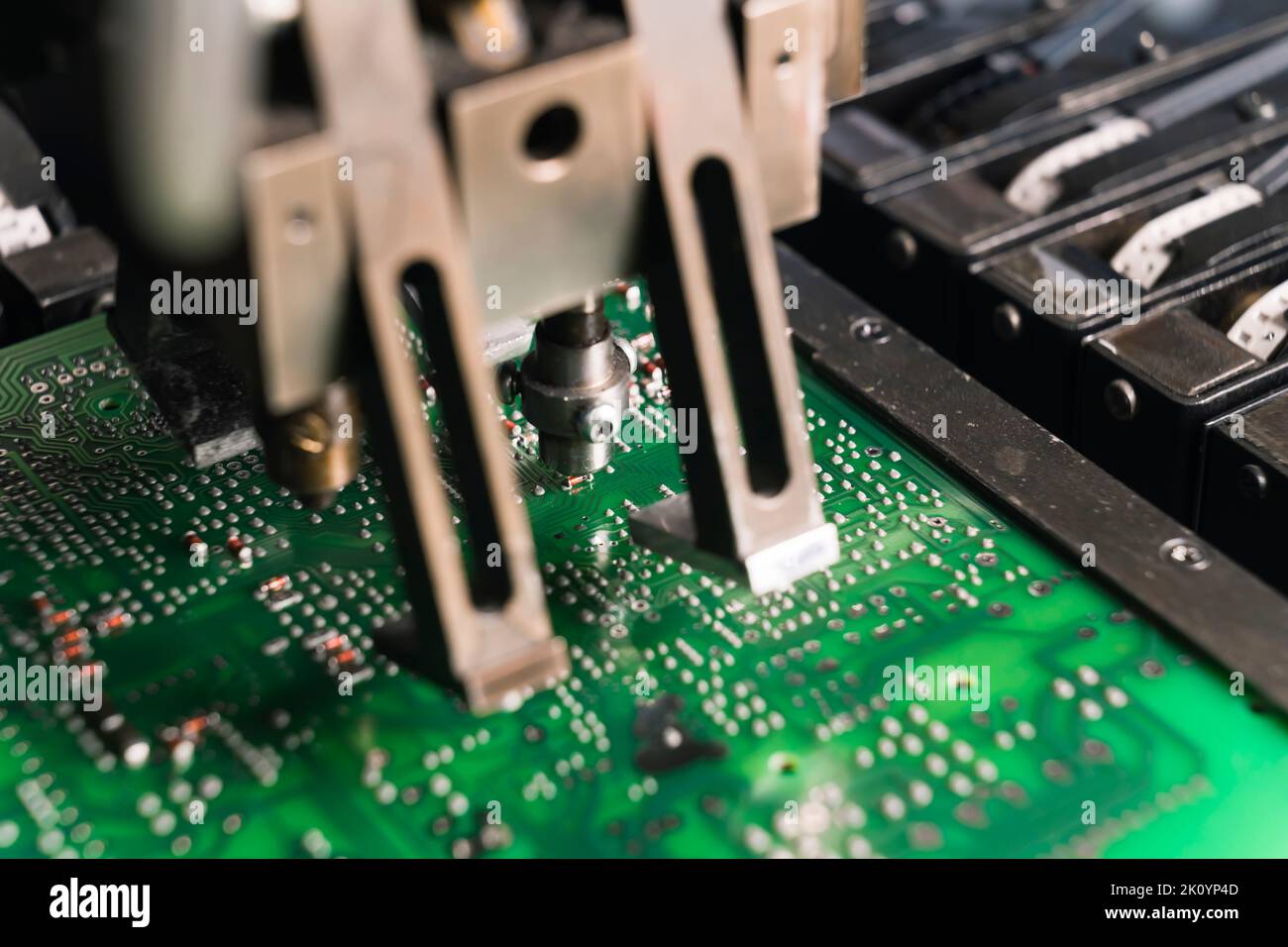 Close up of SFD surface-mount device working on PCB printed circuit board. Assembling. Modern technology. Horizontal shot . High quality photo Stock Photo