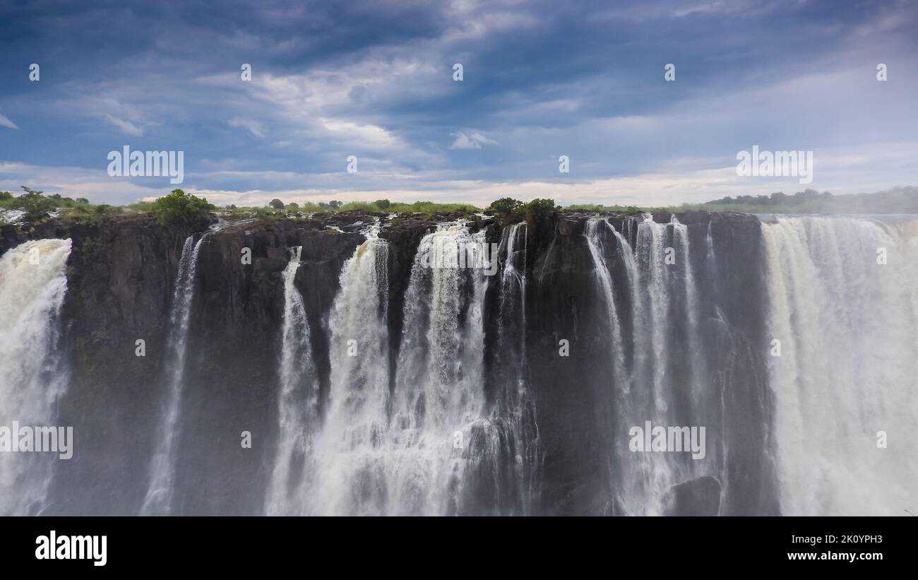 Victoria Falls in the rainy season with lots of water and fog - frontal shot. Stock Photo