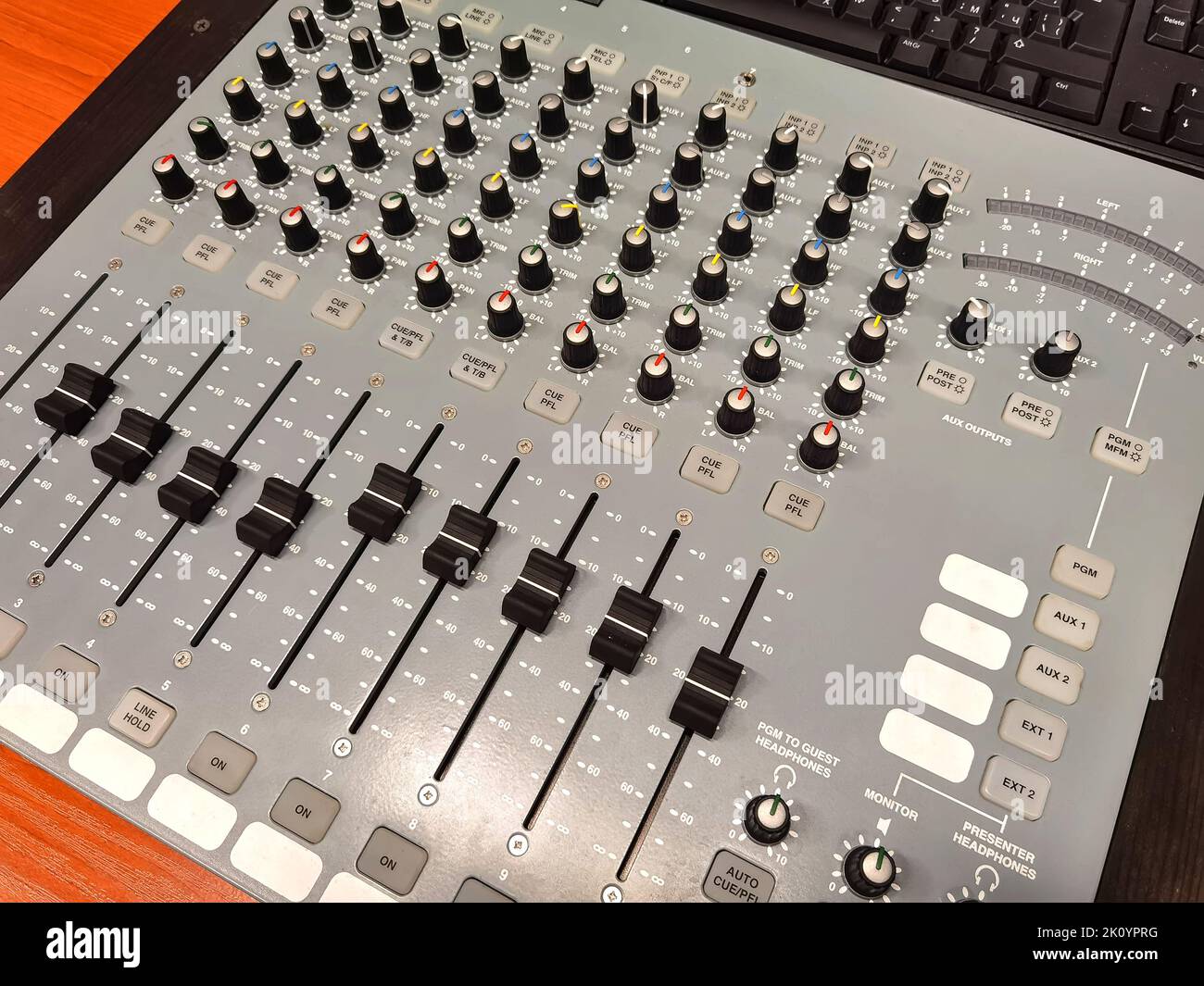 Sound recording directors console. Many buttons of grey audio mixer