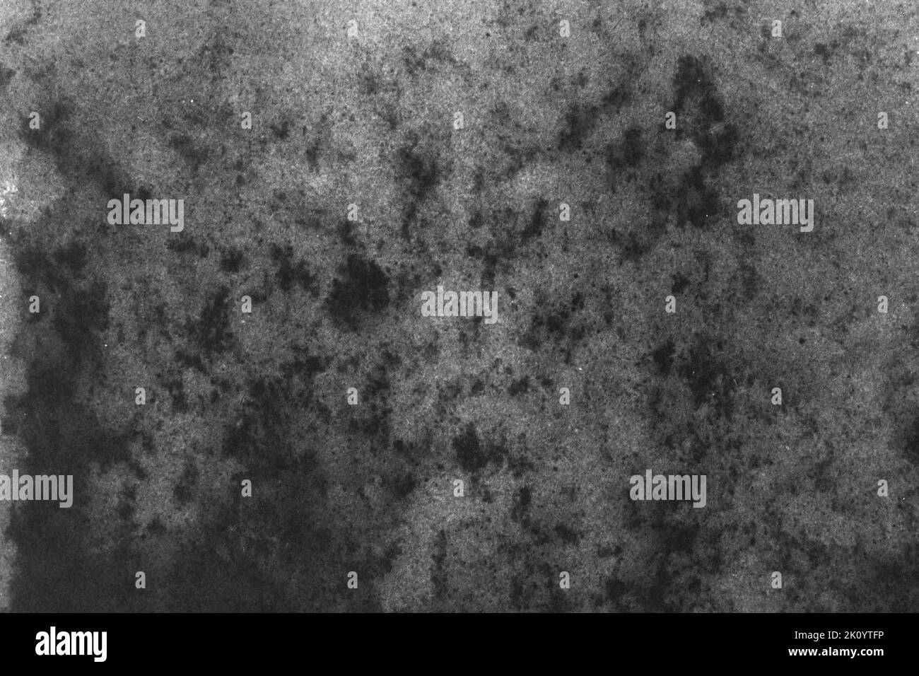 black and white texture of old paper with water stains as a background ...