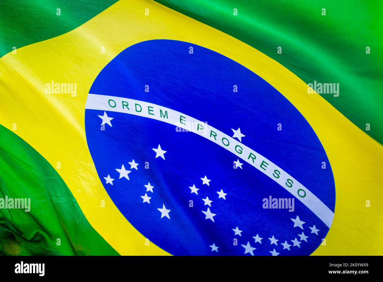 National flag of Brazil blowing on blue sky in Brasilia, South America Stock Photo - Alamy