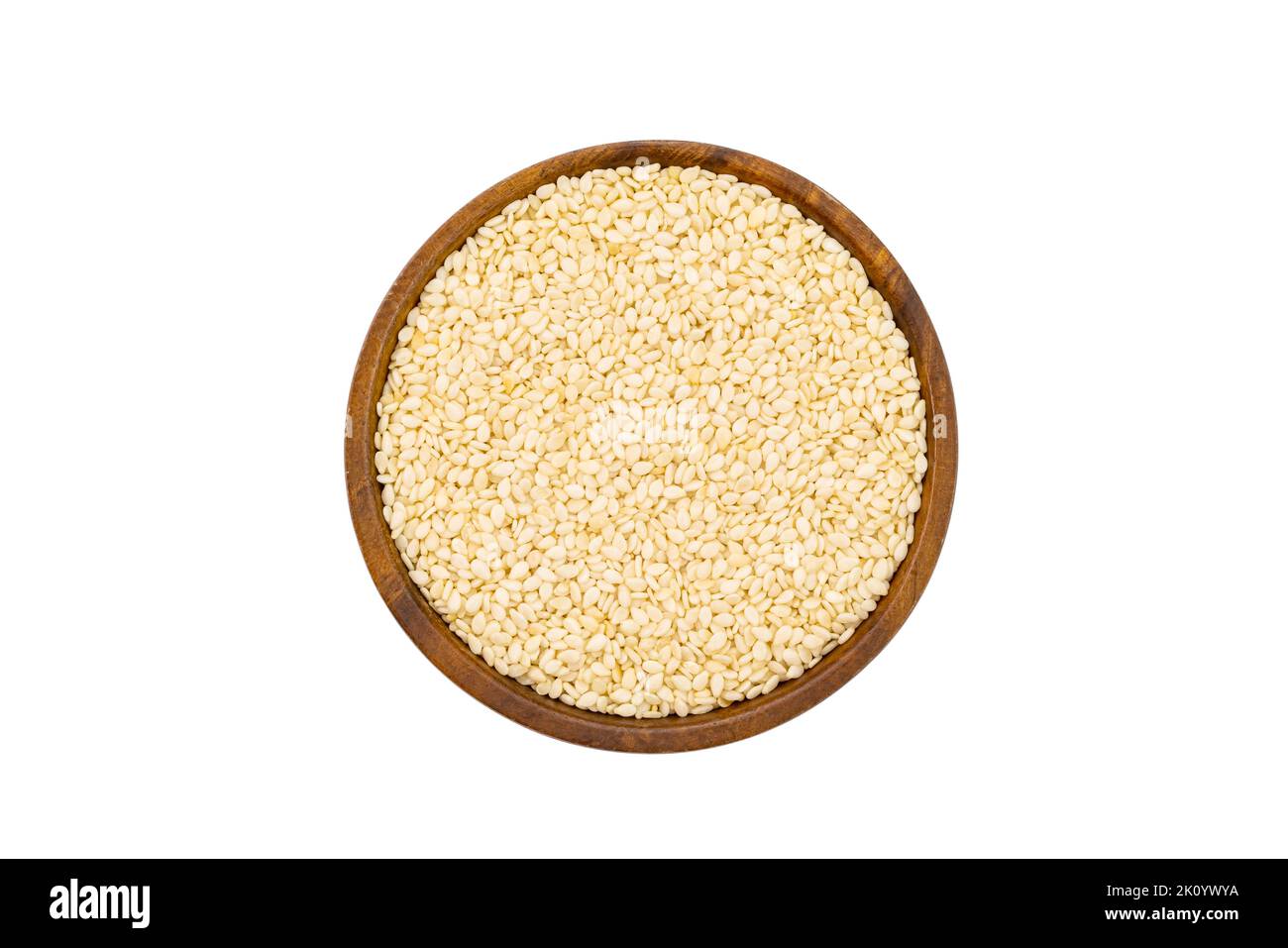 Top view or flat lay of fresh raw white sesame in wooden bowl isolated on white background with clipping path. Stock Photo